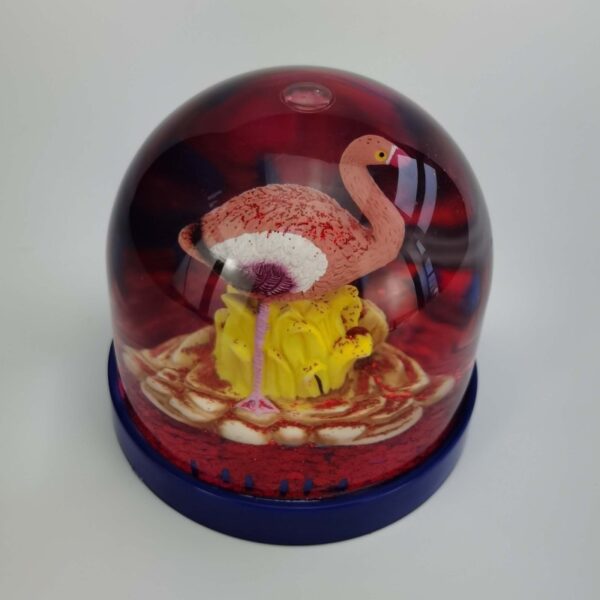 flamingo Christmas snow globe